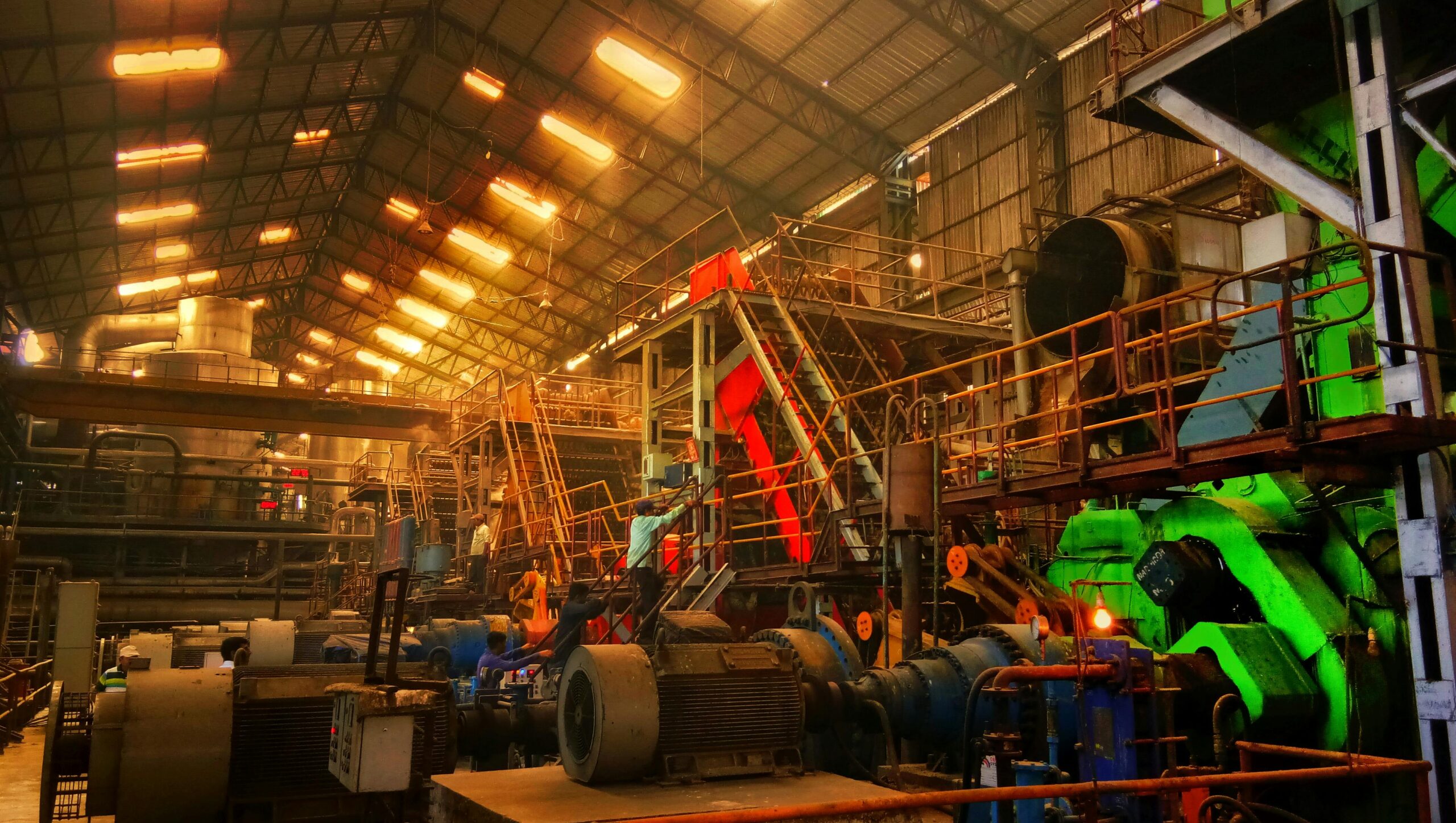 Detailed interior view of a bustling industrial factory in Ahmedabad, India.